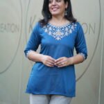 Kala Creation Beautiful Neckline Embroidered Work Plain Short Kurti