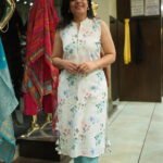 Kala Creation White Kurta Featuring A Blue And Pink Floral Pattern, Paired With Light Blue Trousers