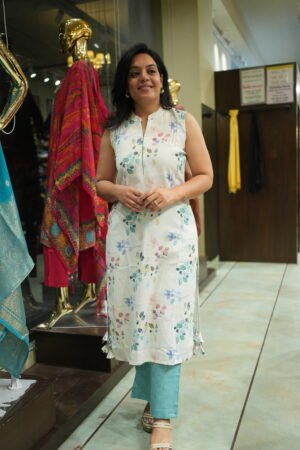 Kala Creation White Kurta Featuring A Blue And Pink Floral Pattern, Paired With Light Blue Trousers